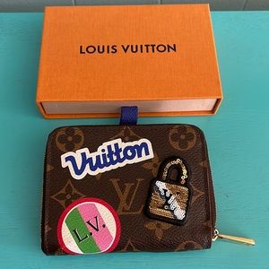 Louis Vuitton zippy  wallet and a gift of Armani exchange Sunglasses.